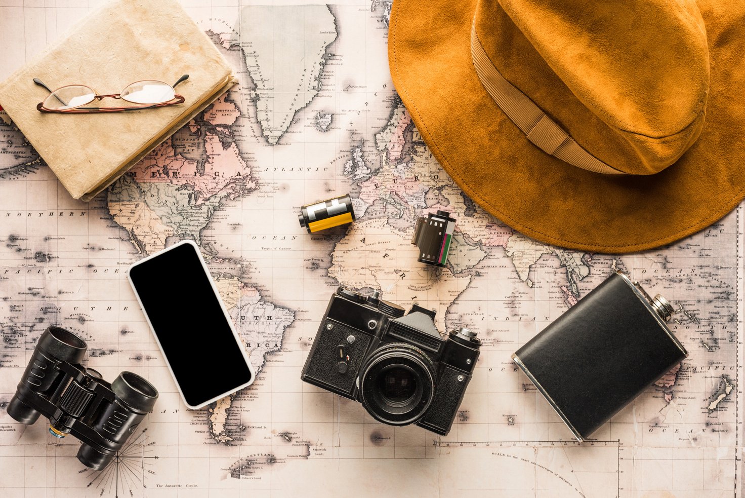 Flat lay of travel essentials including showcasing the importance of well-prepared travel planning.